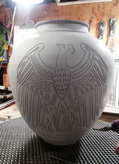 Phoenix carved in clay