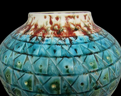 Glass decoration on a green Ceramic Vase